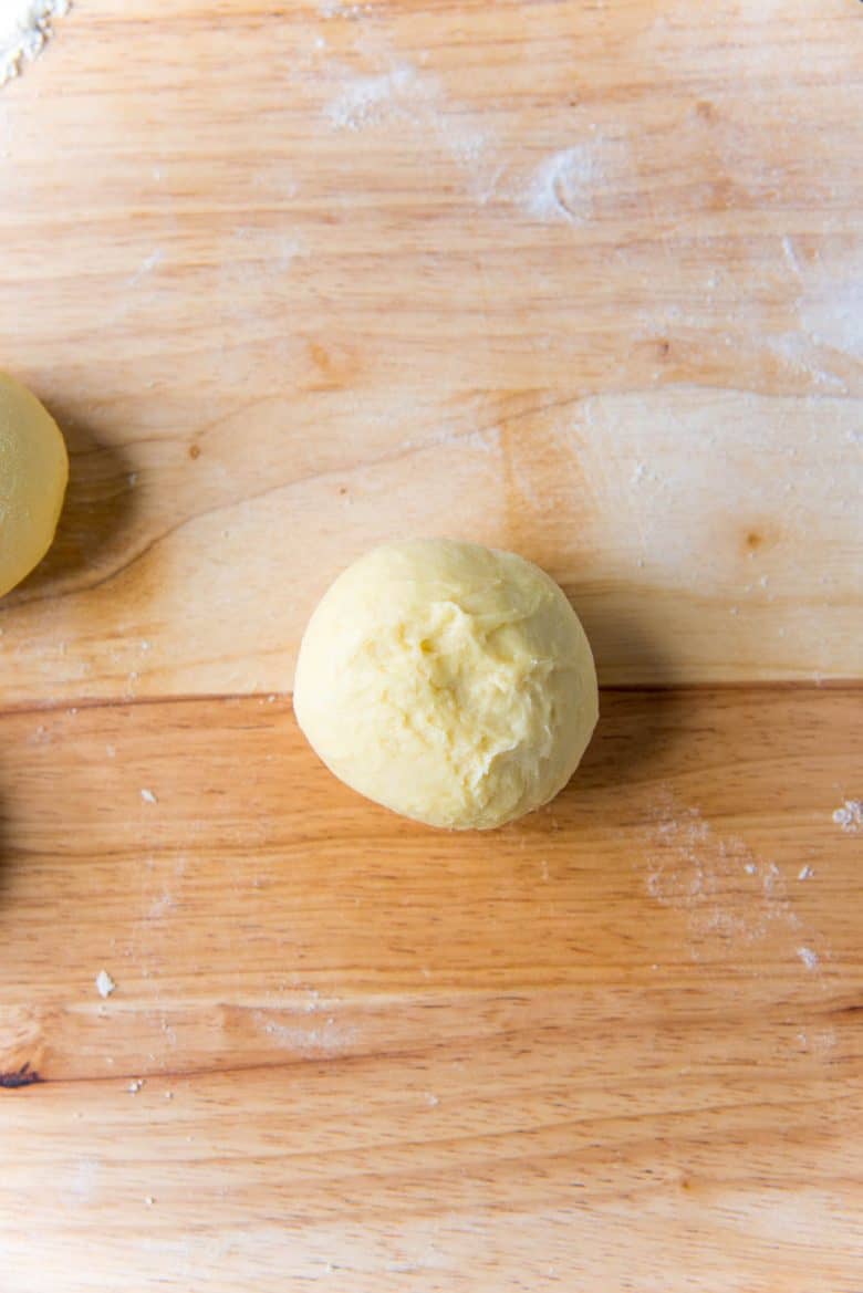 A round dough ball that is sealed all around so that no seams are showing.