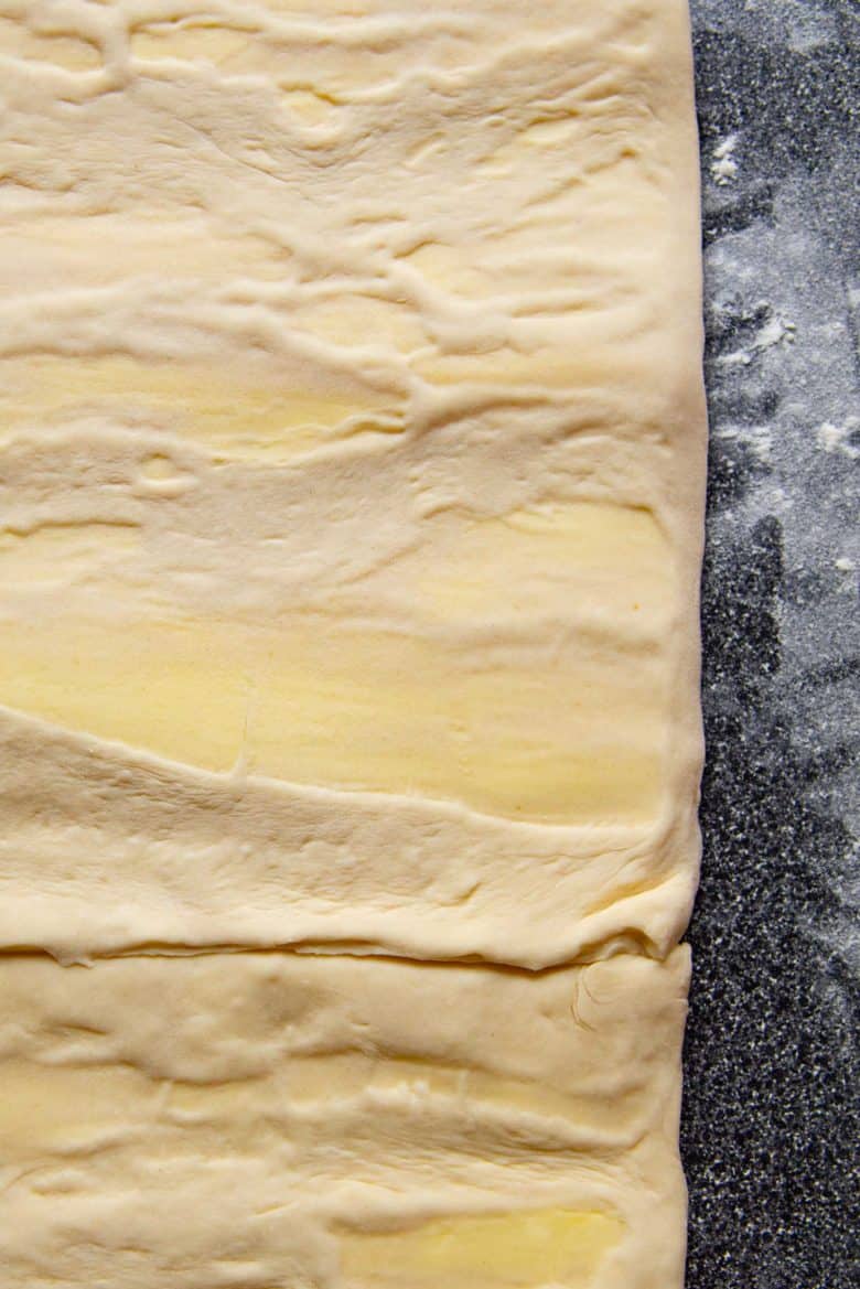 The butter inside the dough was too brittle and broke inside the dough.