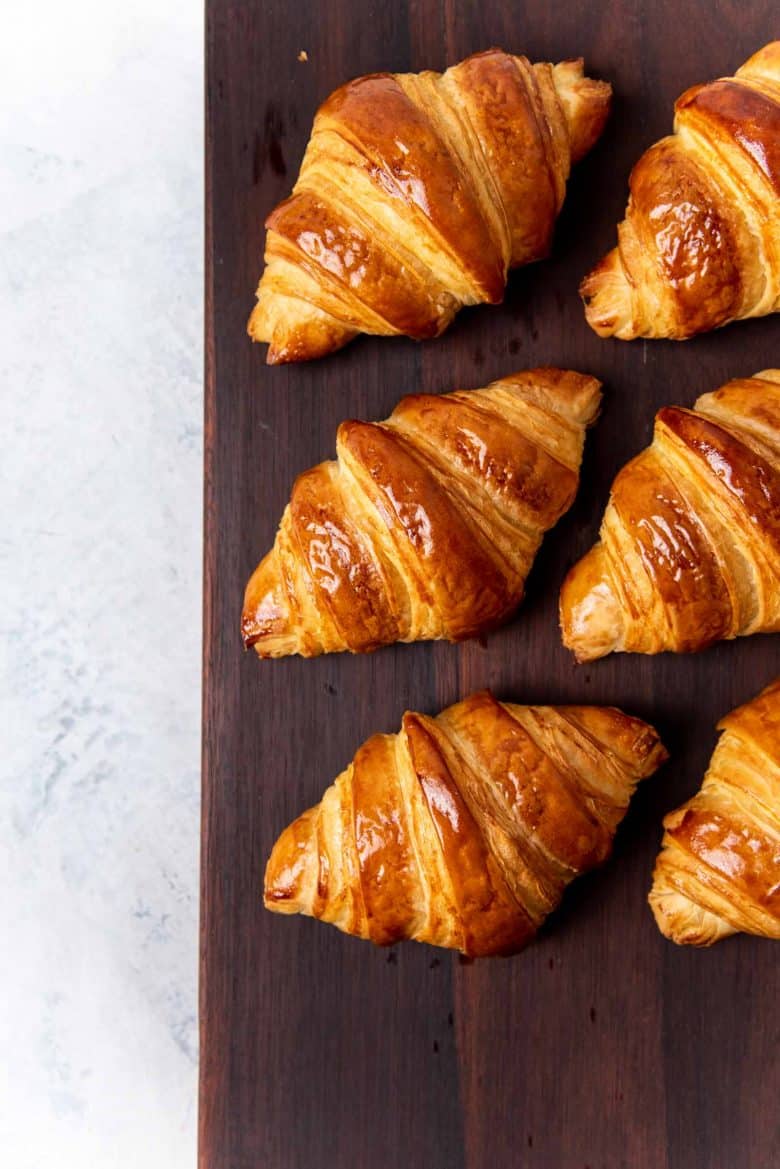 An overhead view of the croissants on a serving block