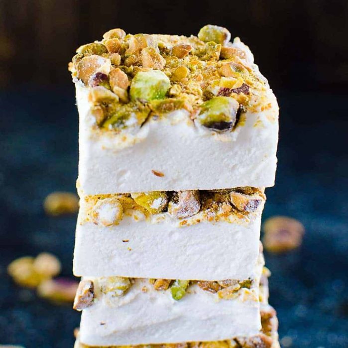 Orange blossom Marshmallows with Pistachios - Fluffy, melt in your mouth homemade Marshmallows made with no corn syrup and so easy to make too! Flavored with exotic orange blossom water and roasted pistachios, these are perfect for gift giving for Christmas or any holiday. 