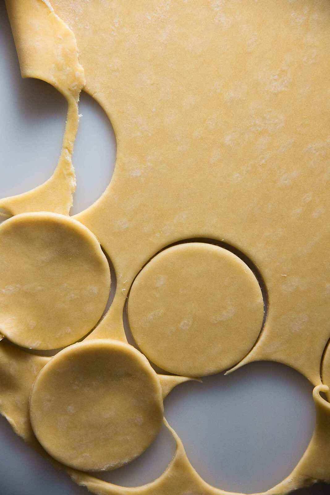 Sri Lankan fish patties - The dough is rolled out and cut into circles. Because of the acid in the dough, and resting time, the dough is pliable without being too soft.
