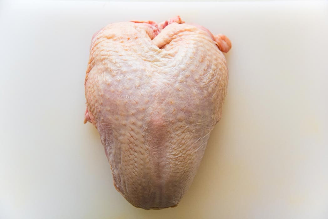 Start with a whole turkey breast with the bone and skin. You will need to fillet the turkey breast to make a Turkey roulade. 