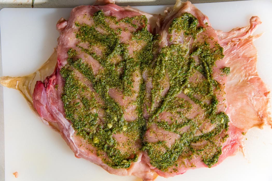 Spread the marinade or spice rub evenly so that it will get into the cuts made on the meat as well.